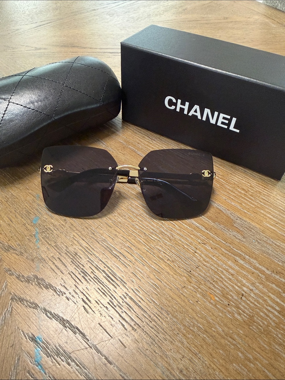 CHANEL Rimless Square Sunglasses in Black and Gold Accents